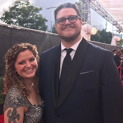 A picture of Cameron Britton with his wife at the Emmys.